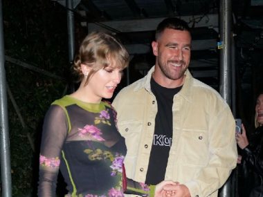Taylor Swift and Travis Kelce Enjoy Elegant Date Night With Her Bandmates in Singapore