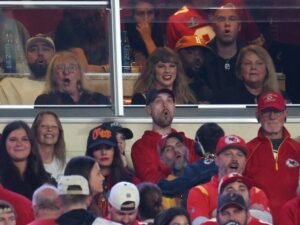 Taylor Swift lets her guard down in the Kansas City Chiefs' suite and the wife of a Chiefs player reveals why