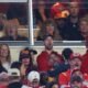 Taylor Swift lets her guard down in the Kansas City Chiefs' suite and the wife of a Chiefs player reveals why